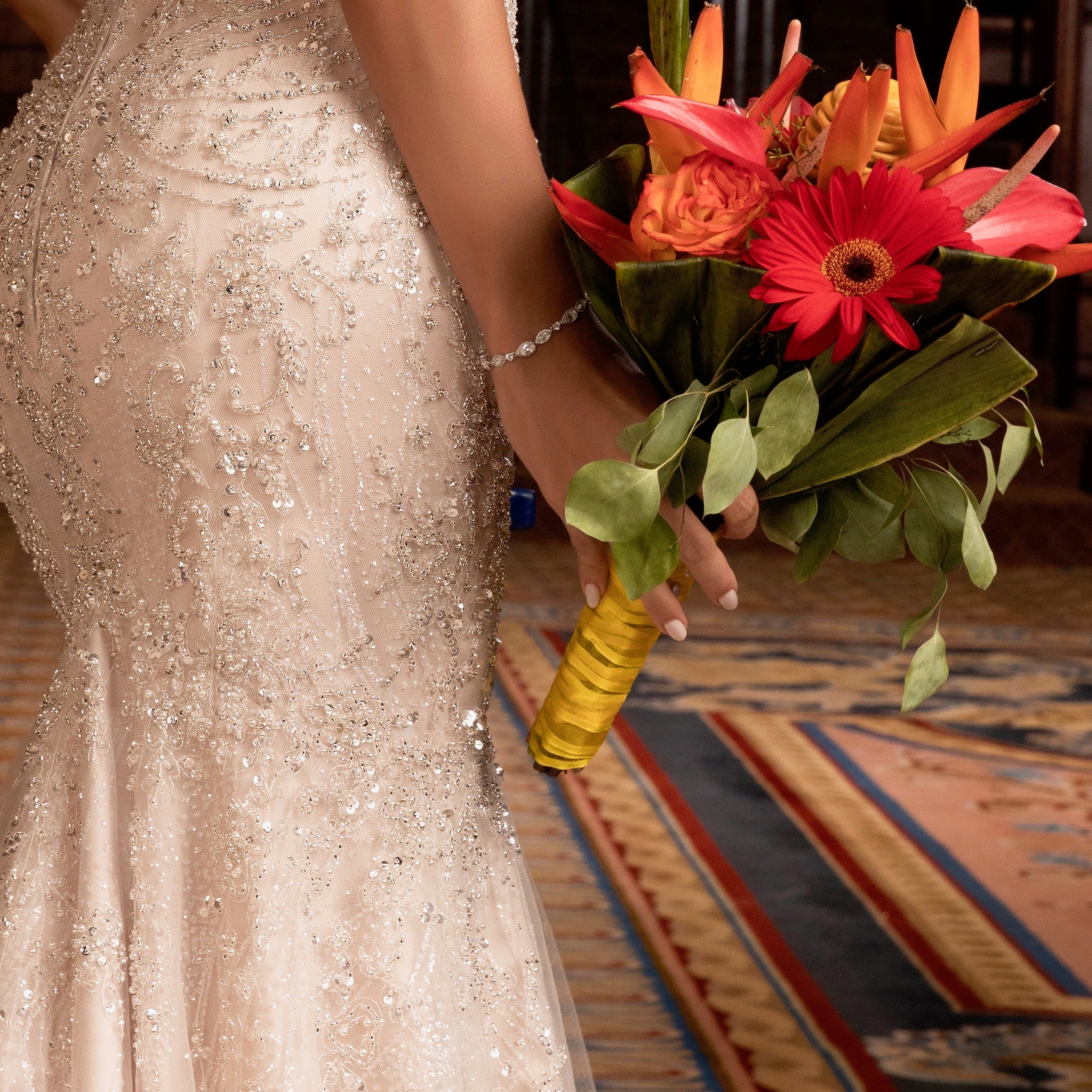Model wearing the Airelle Cubic Zirconia Bracelet and holding a bouquet