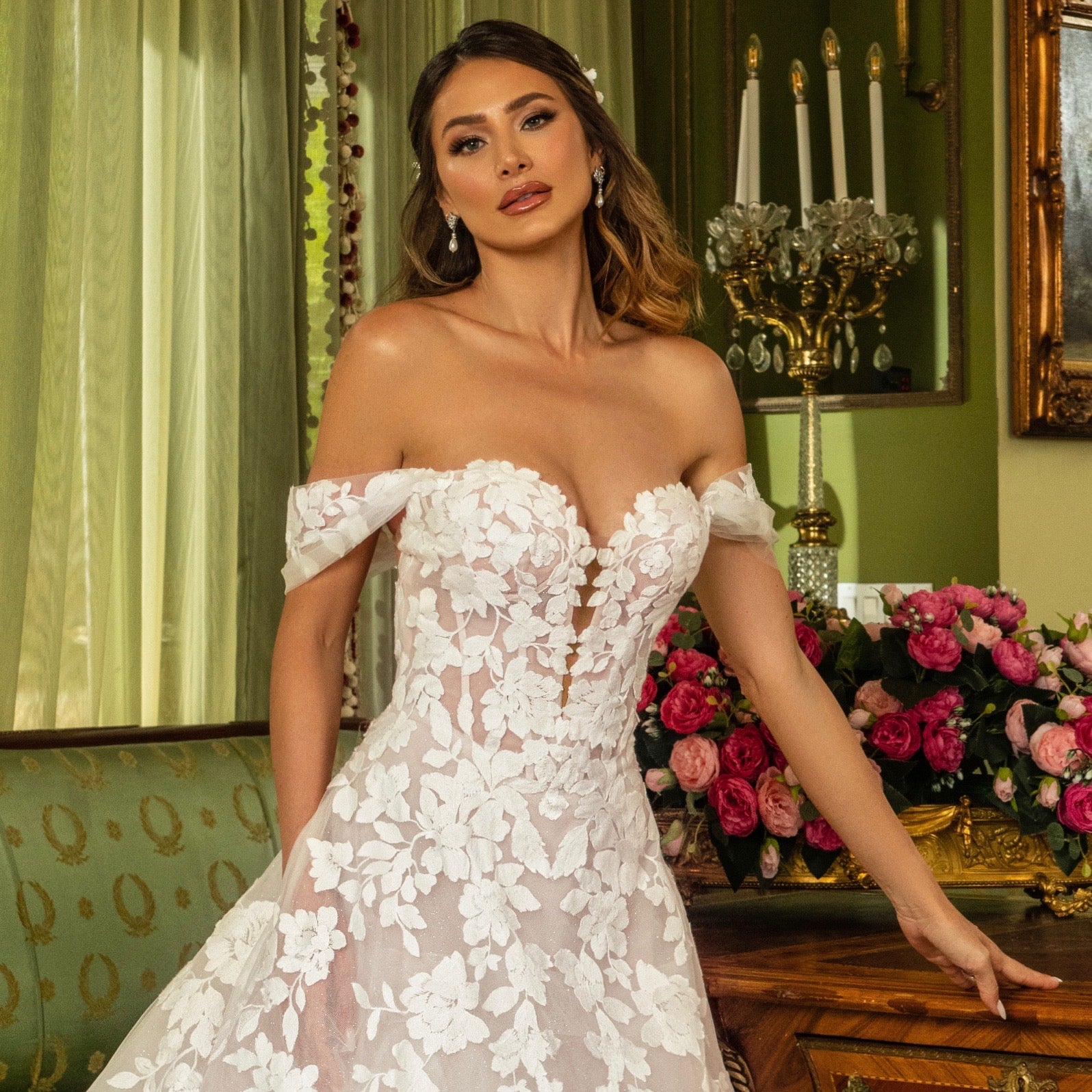 Julia Pearl Earrings from Anna Bellago. Clusters of Cubic Zirconia stones with a glass white teardrop pearl. Bride is wearing a Kitty Chen Bridal Gown