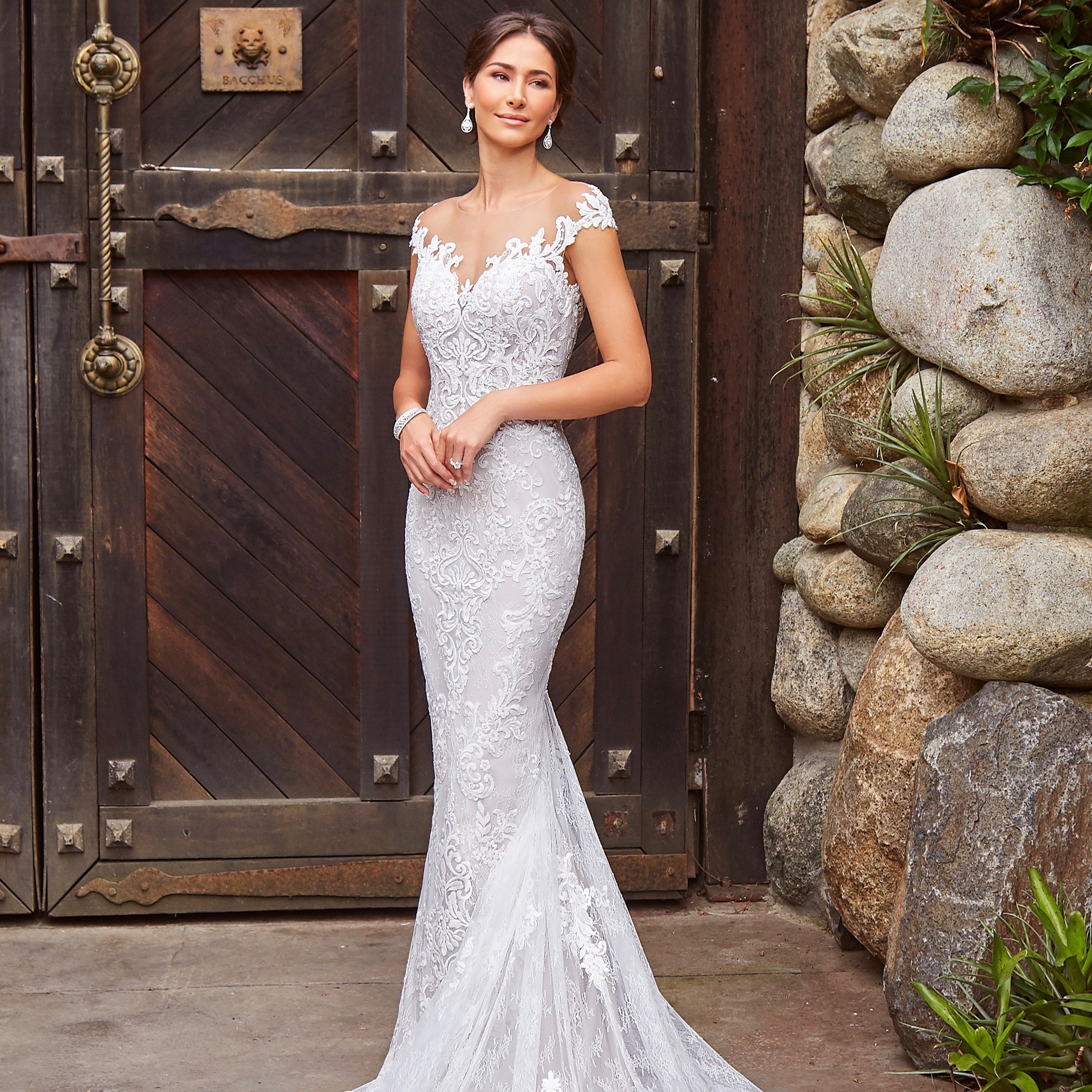 Model wearing a Kitty Chen Gown and Anna Bellagio 's Madelena Art Deco Inspired Bangle Bracelet