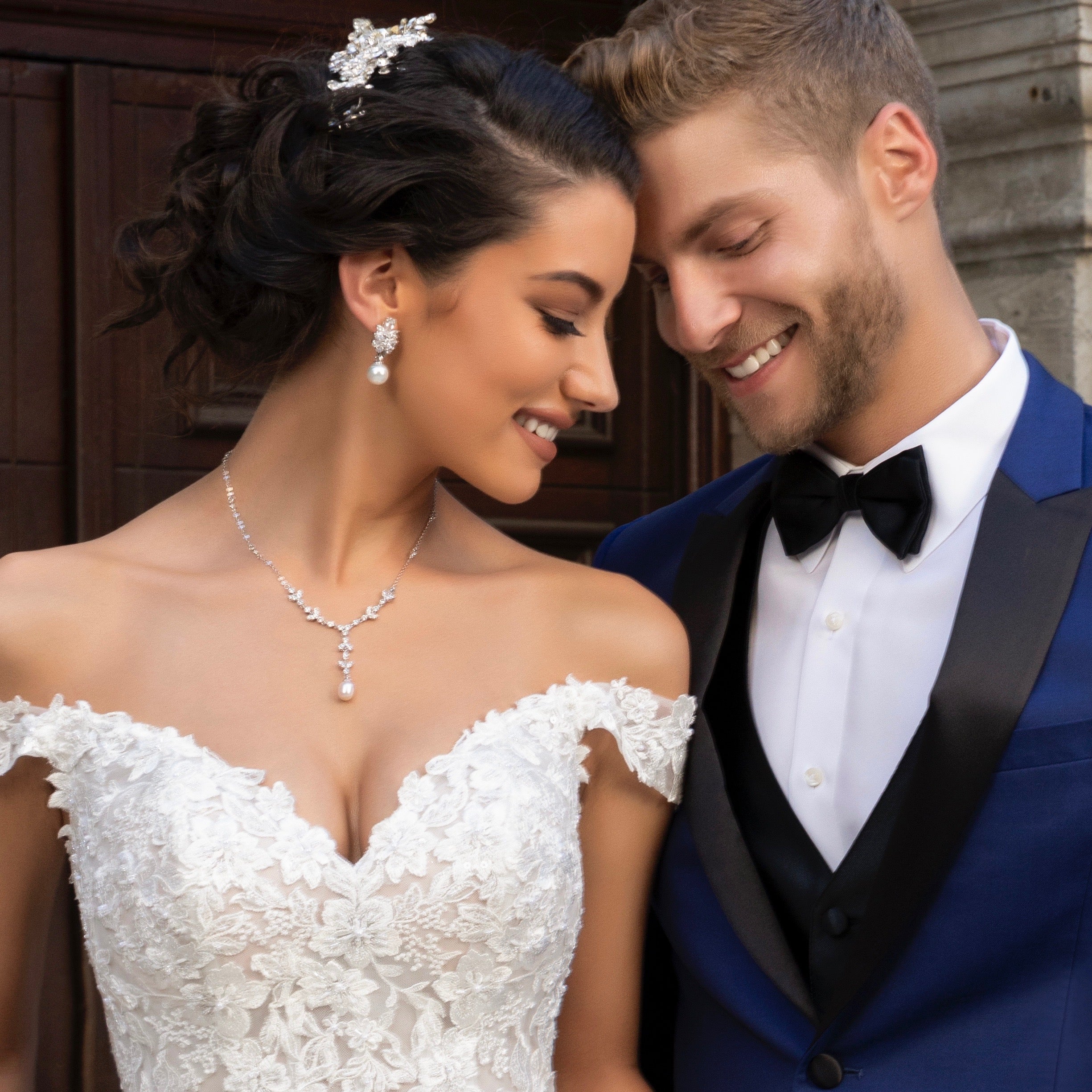 Bride and Groom, Bride is wearing th Primrose Necklace and the Luisa Earrings