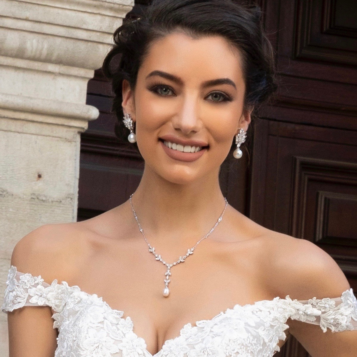 Model Bride is wearing the Primrose Pearl Vine Necklace from Anna Bellagio in a Kitty Chen Bridal Gown.