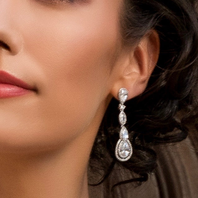 Airelle Cubic Zirconia Earrings on a model showing her earring on her ear.