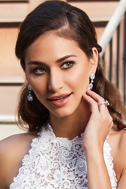 Alaine Earrings Model touching Earring