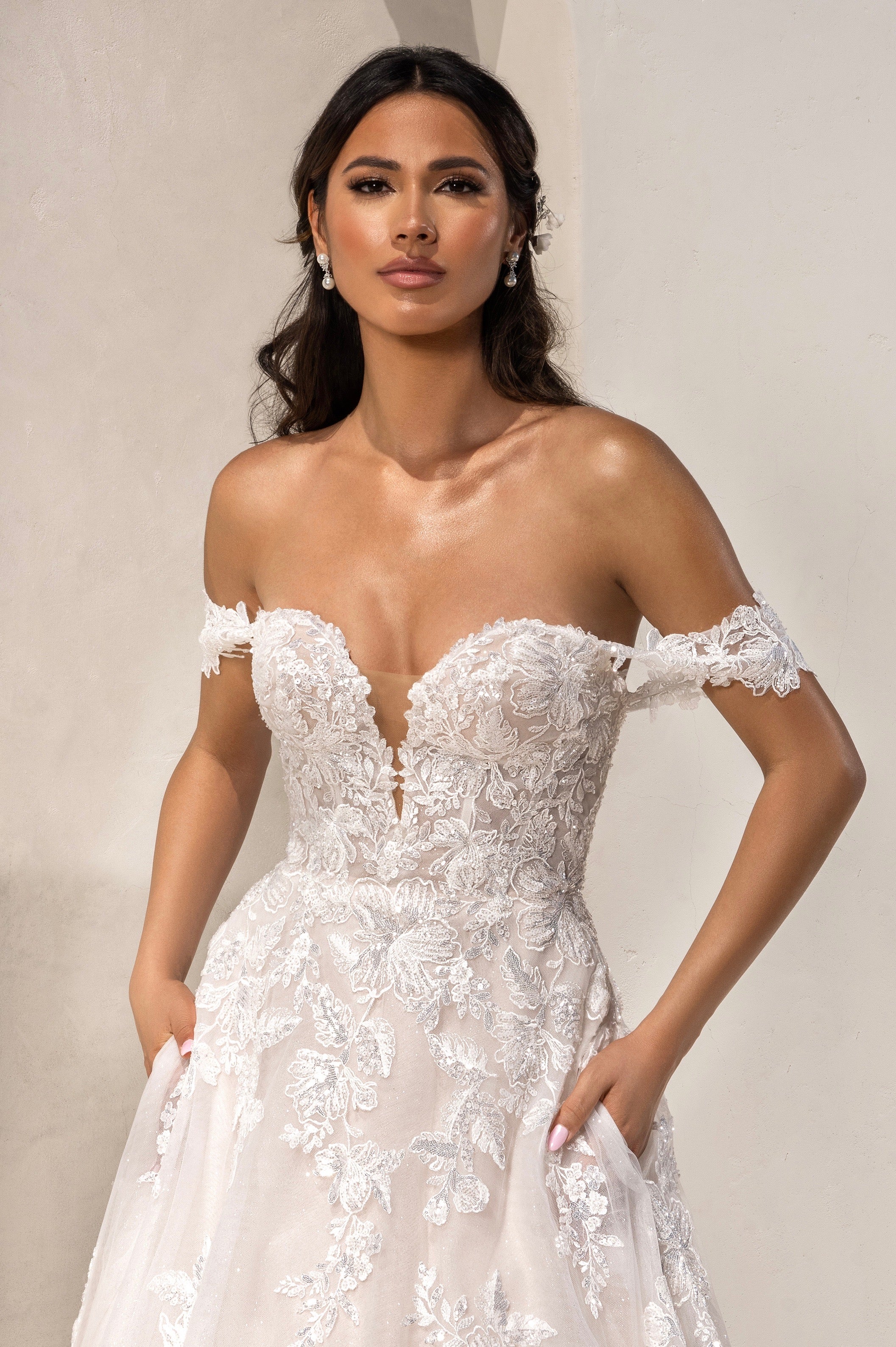 Model wearing a Kitty Chen Bridal Gown paried with the Gemma Pearl Dangle Earrings