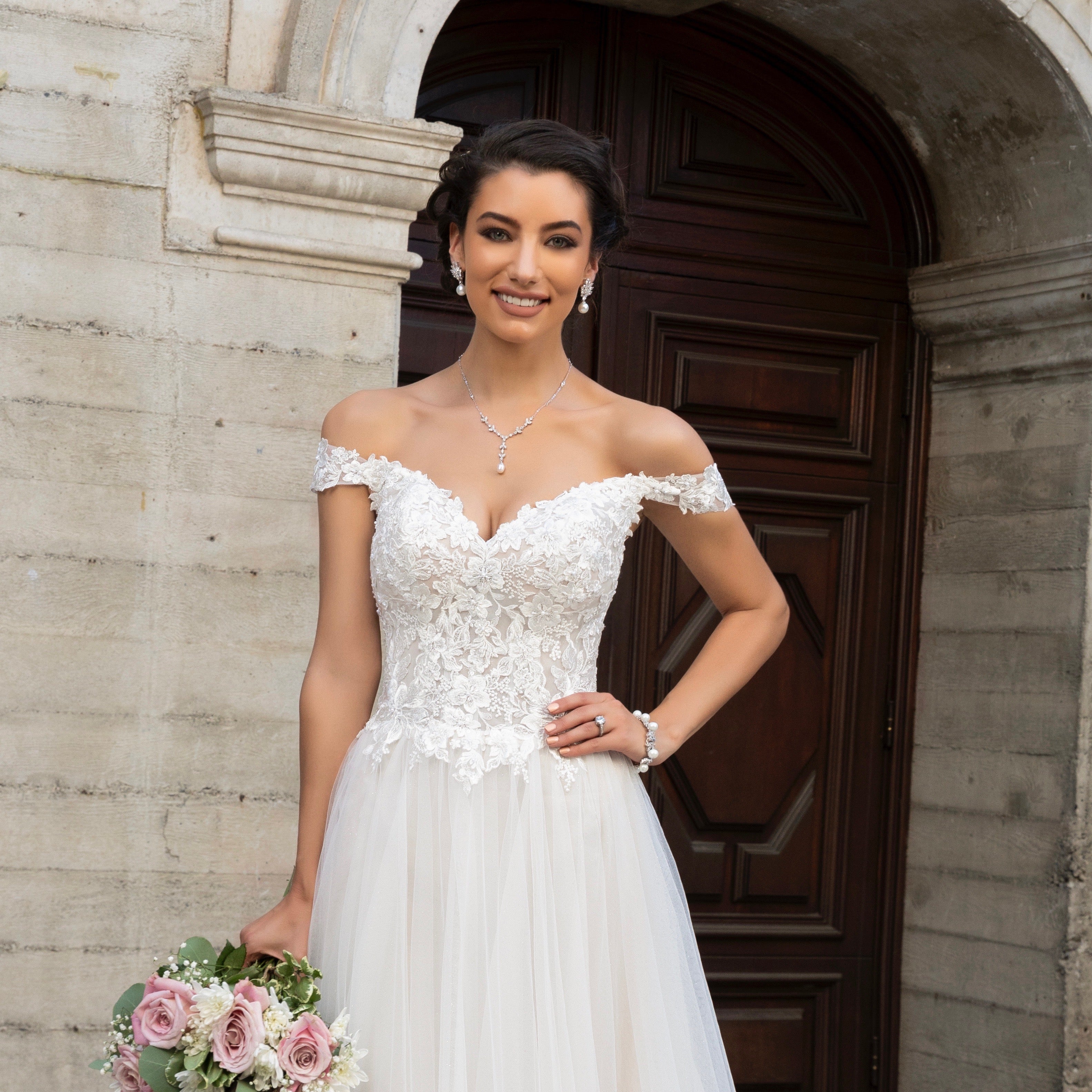 Bride wearing a Kitty Chen Bridal Gown with the Luisa Earrings and the Primrose Necklace
