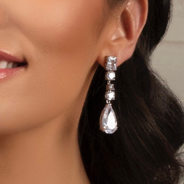 Brielle Linear Dangle Earrings on a Model showing only her ear. 