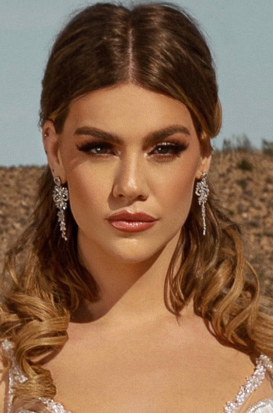 Trina Statement Earrings Close-up | Anna Bellagio Close up of a Model wearing the earrings in a bridal gown in the Desert