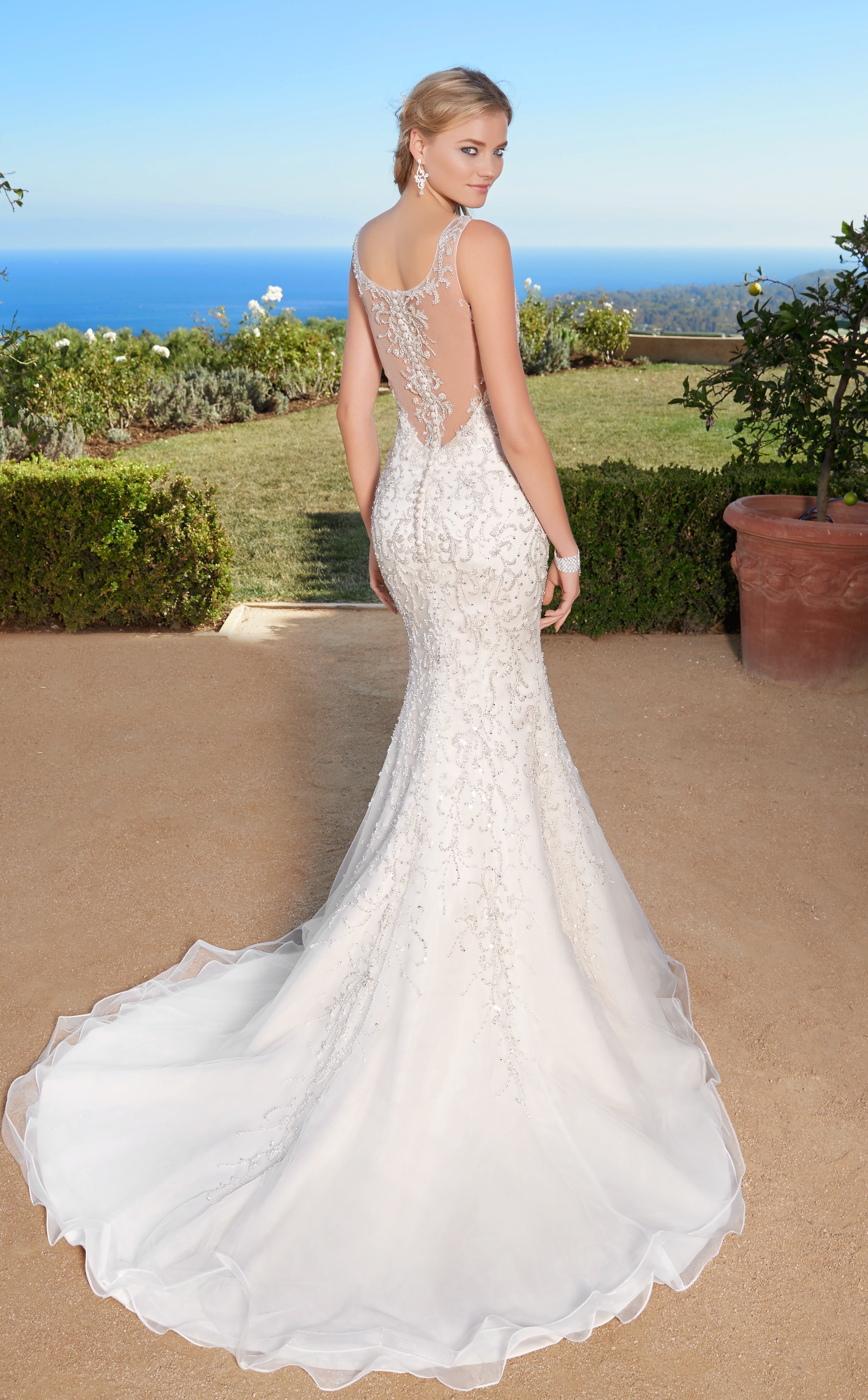 Aria Scroll Inspired Statement Earrings on Model wearing a Naveah Gown from Kitty Chen Couture