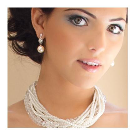 Ellie Colored Pearl Earrings from Anna Bellagio worn by the face of Anna Bellagio Raquel.